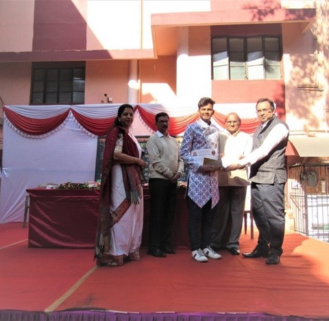 Student receiving the Award for Book Review Competition